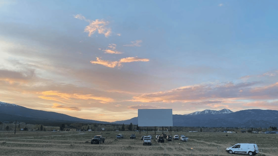 Colorado drive-in movies theater screen under starry night sky
