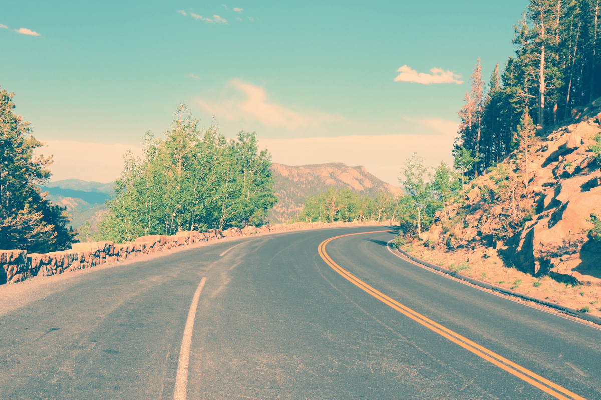Colorado road trip scenic mountain highway winding through peaks