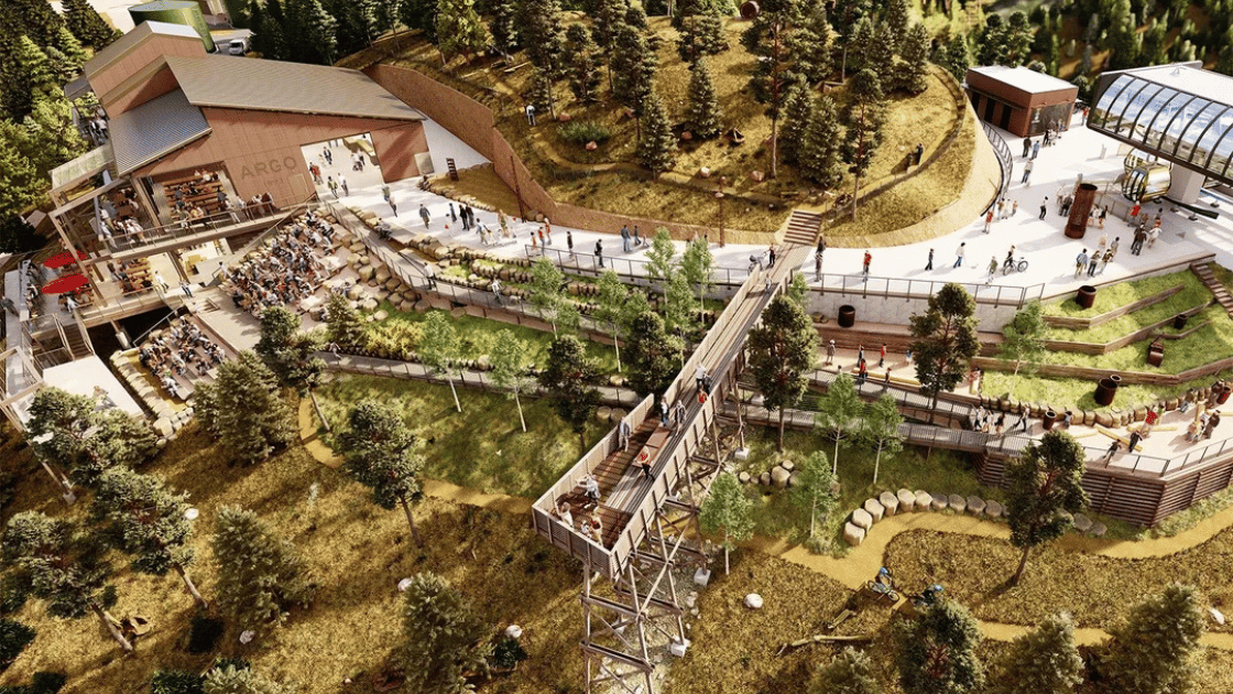 Idaho Springs Gondola ascending above historic mining town with Rocky Mountains