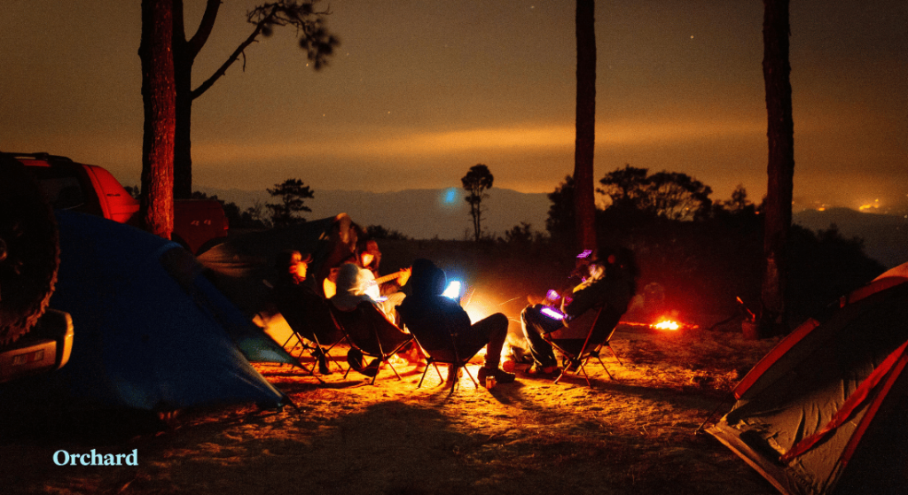 Campfire glowing at a budget camping Colorado campsite under the stars